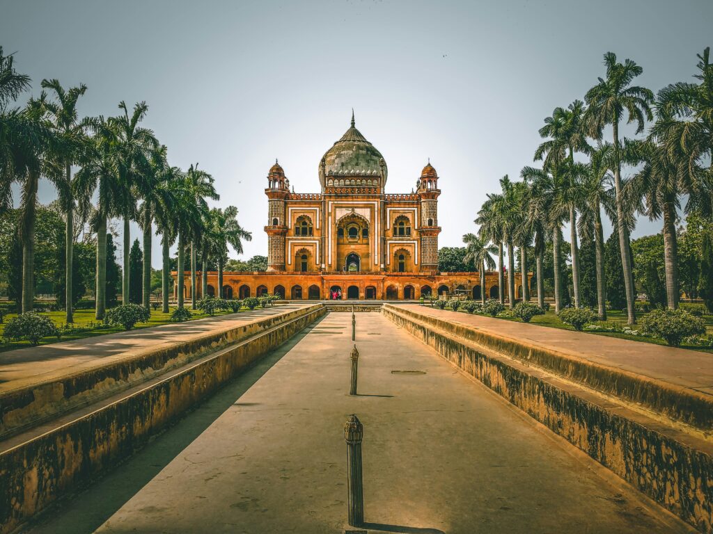 pexels-photo-1007426-1007426 Explore the stunning Safdarjung Tomb in New Delhi, India, surrounded by lush gardens and palm trees.
